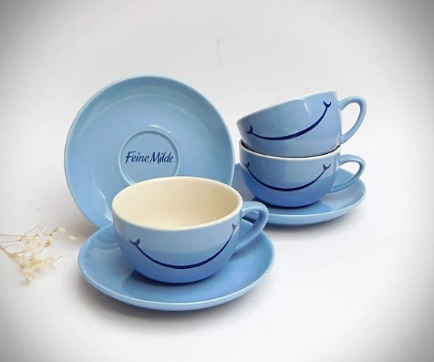 Tchibo "Feine Milde" good mood cup and saucer in light blue, laughing cup, coffee cup